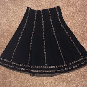 Knee length black skirt
